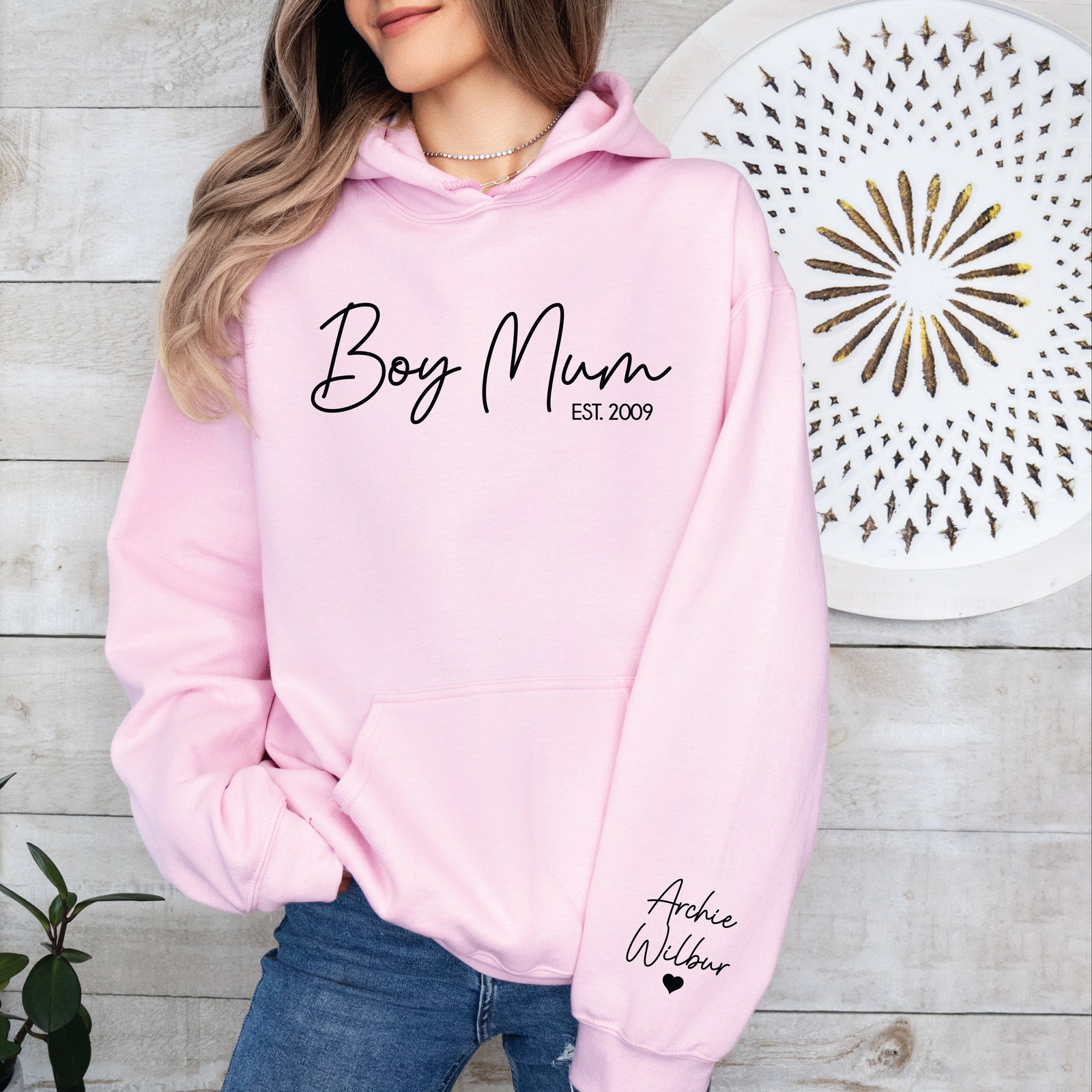 Woman wearing Boy Mum hoodie with sleeve detail in outdoor setting, Mother’s Day gift idea