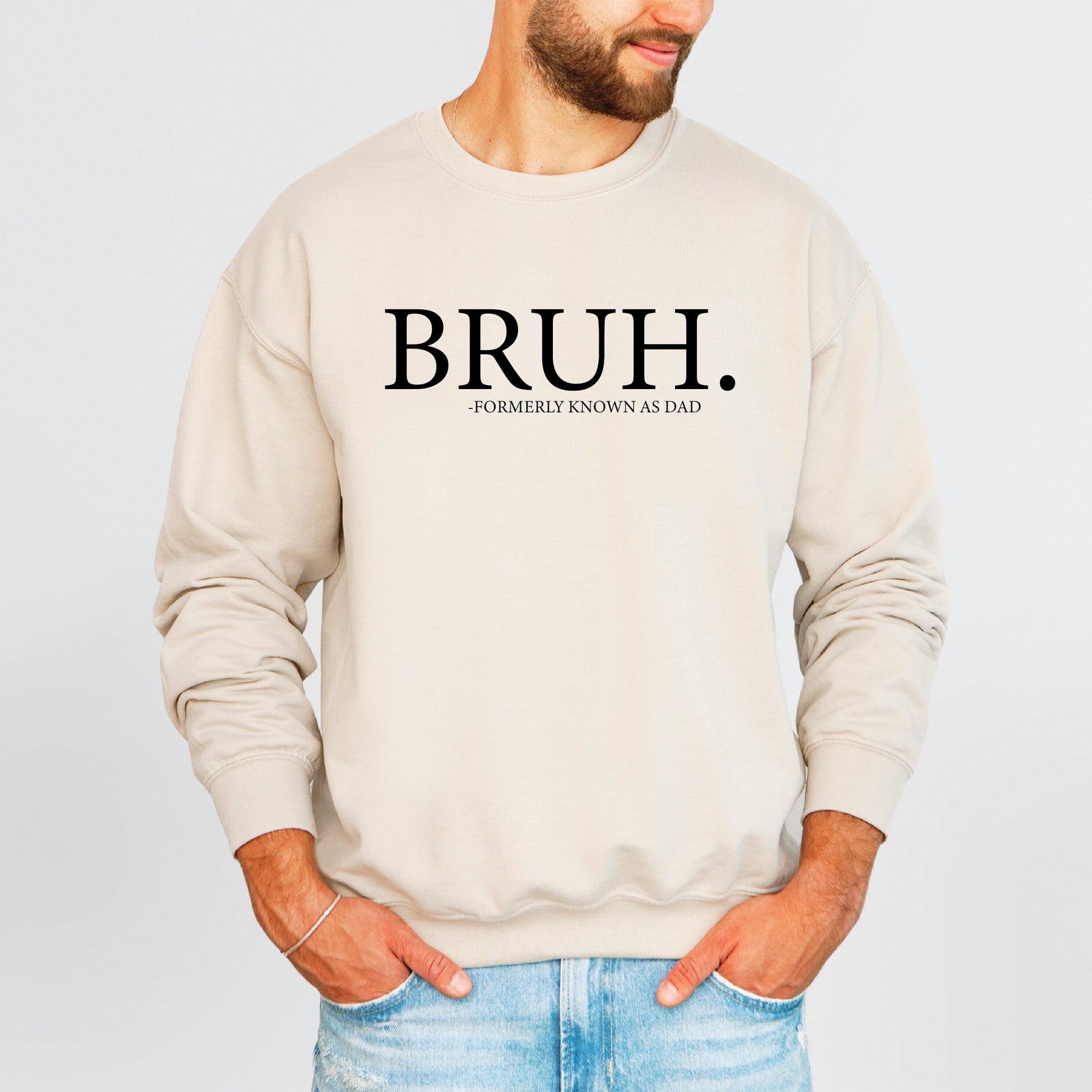 Man wearing an ecru crew neck sweatshirt that reads Bruh, formerly known as Dad.
