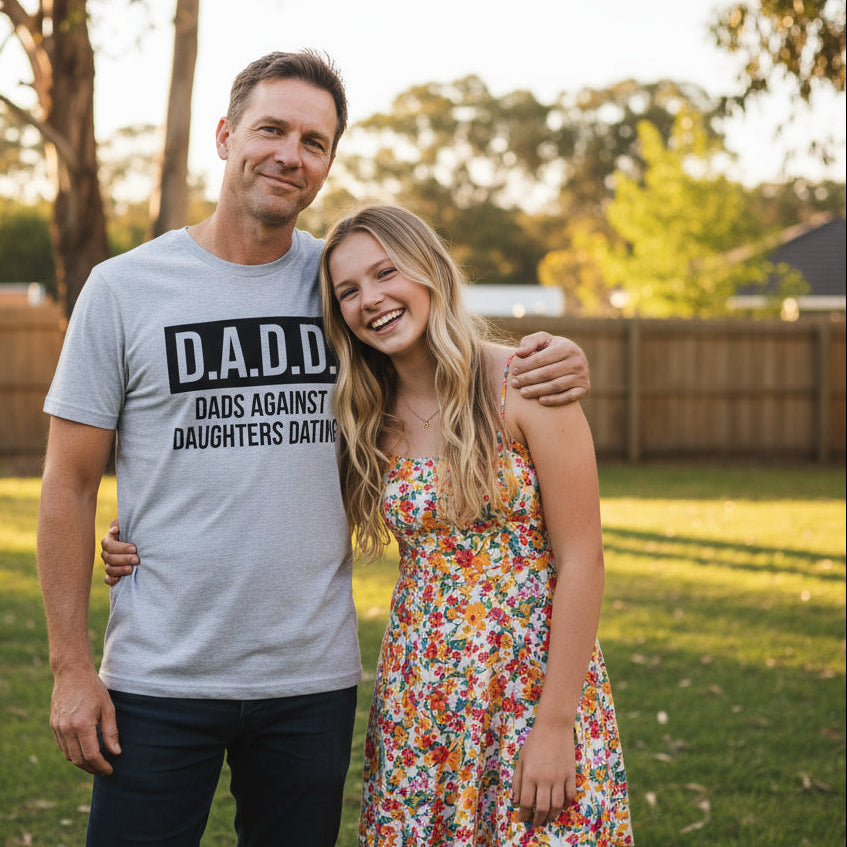 grey t-shirt reading D.A.D.D. Dads Against Daughters Dating in bold black lettering.