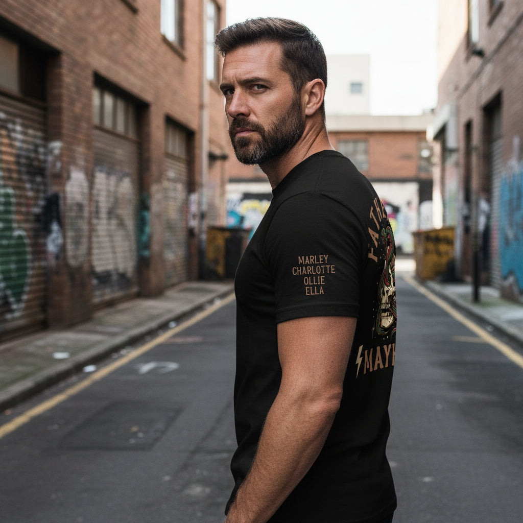 Man wearing a black t-shirt with a tattoo style skull and snake back print reading Father Of Mayhem and personalised names on the sleeve.