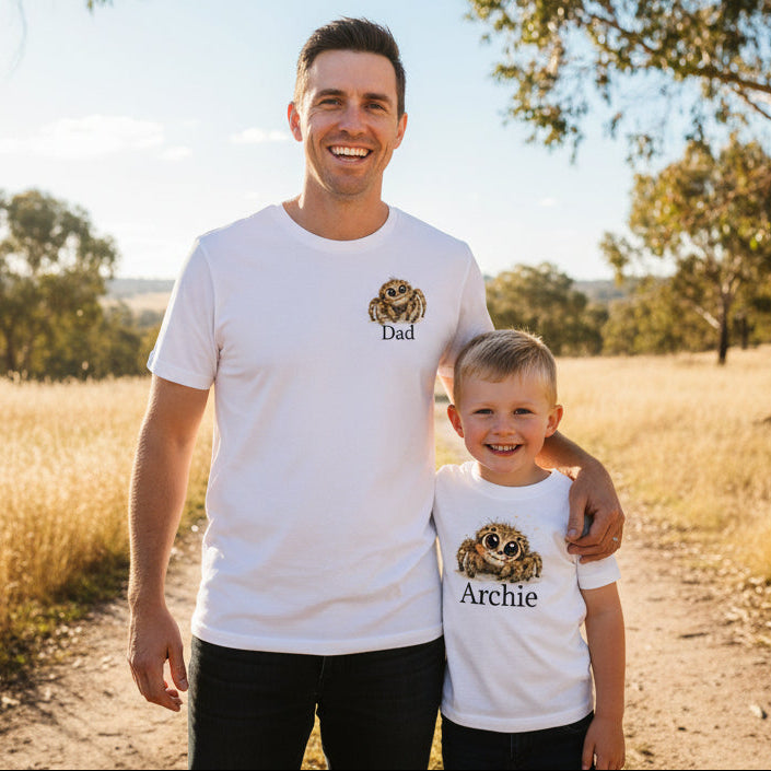Dad and child wearing matching personalised huntsman spider shirts