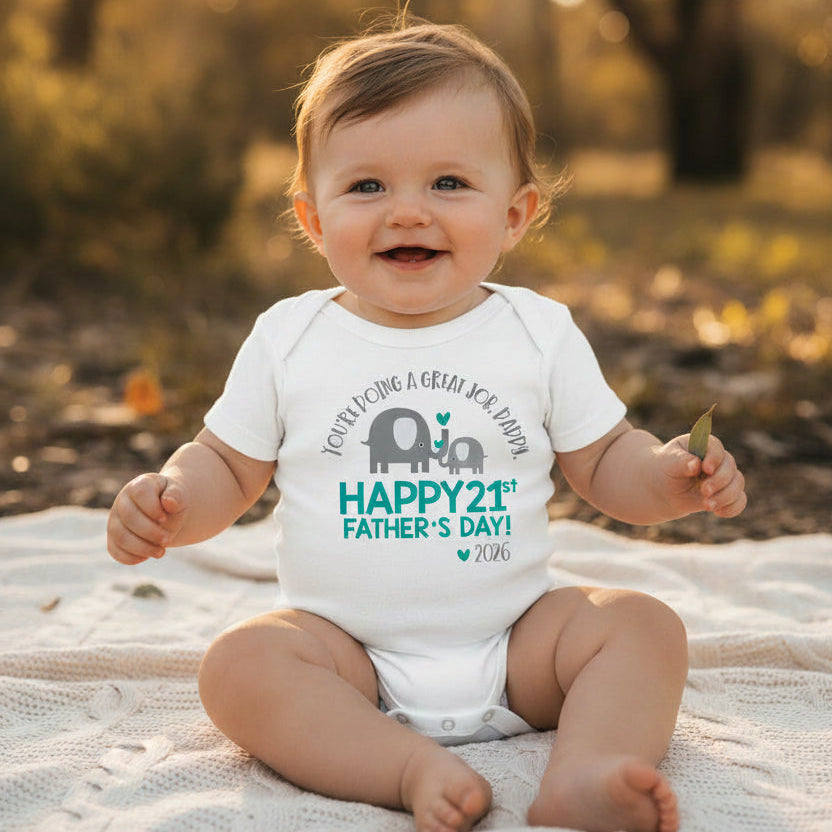 White baby bodysuit with a teal elephant and calf design reading You're Doing A Great Job Daddy, Happy 1st Father's Day, and the year.