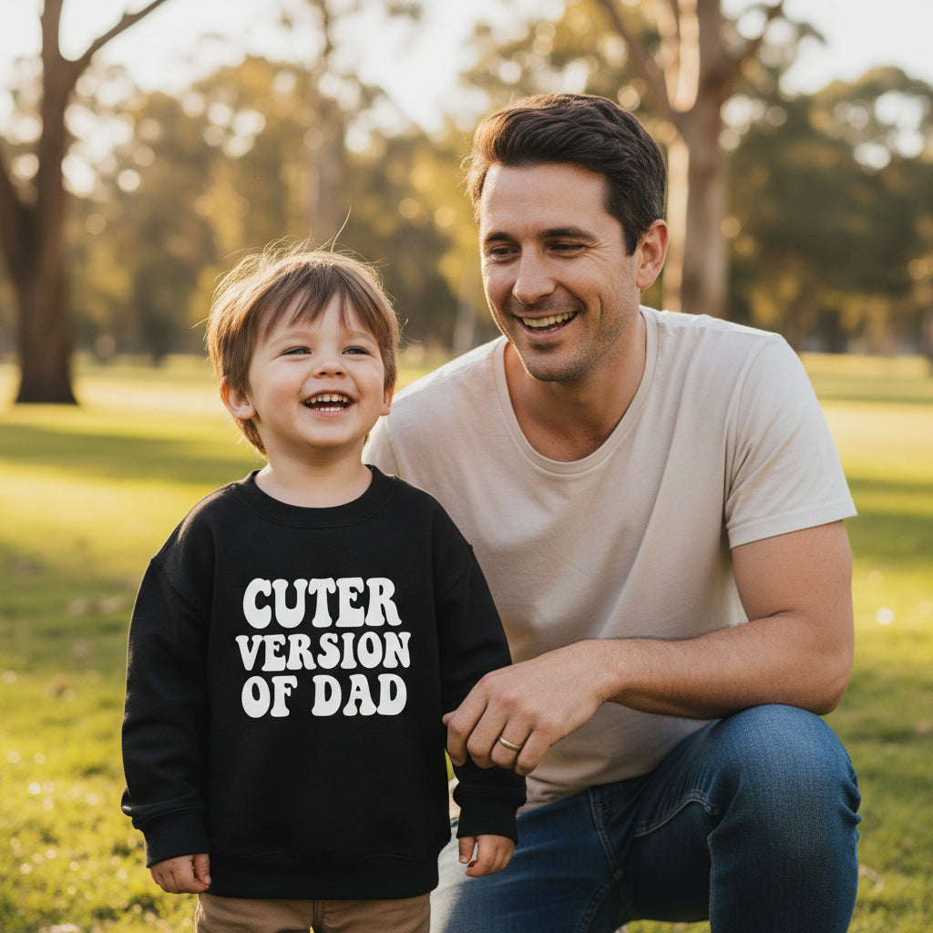 Black kids crew neck jumper reading Cuter Version Of Dad in a white retro wavy font.