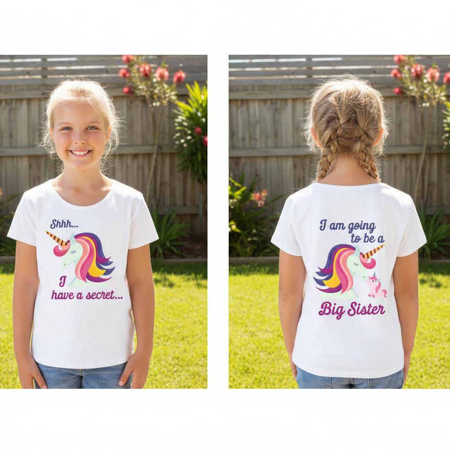 Girl wearing a white t-shirt with a unicorn and Shhh I Have A Secret on the front and I Am Going To Be A Big Sister on the back.