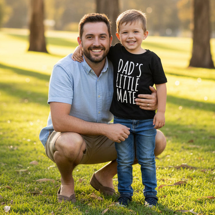 Black kids t-shirt with a design reading Dad's Little Mate.