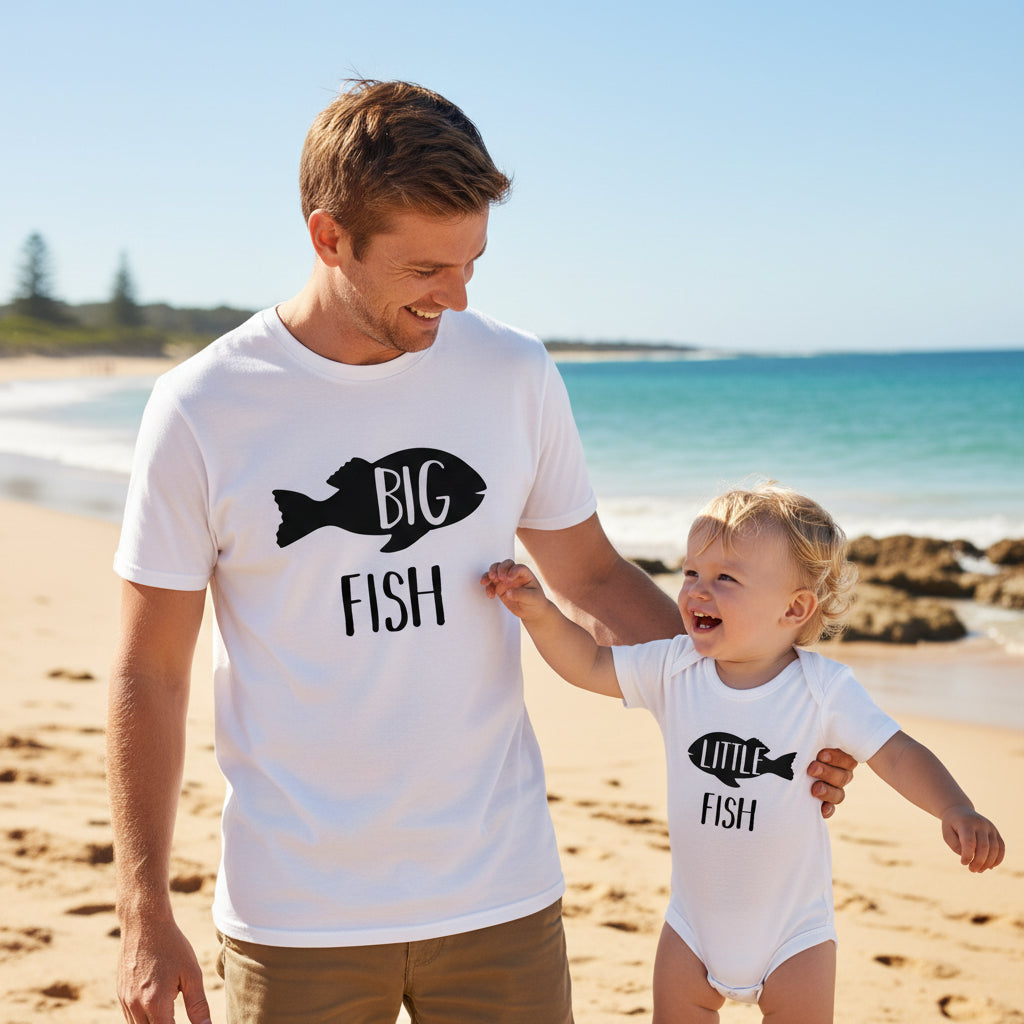 Tilly&Wilbur white matching set — an adult tee printed with "Big Fish" and a baby bodysuit printed with "Little Fish," each with a black fish graphic.