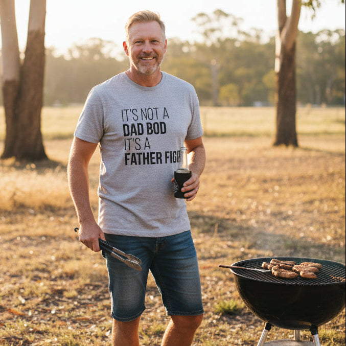 Grey t-shirt with bold white text reading It's Not A Dad Bod It's A Father Figure.