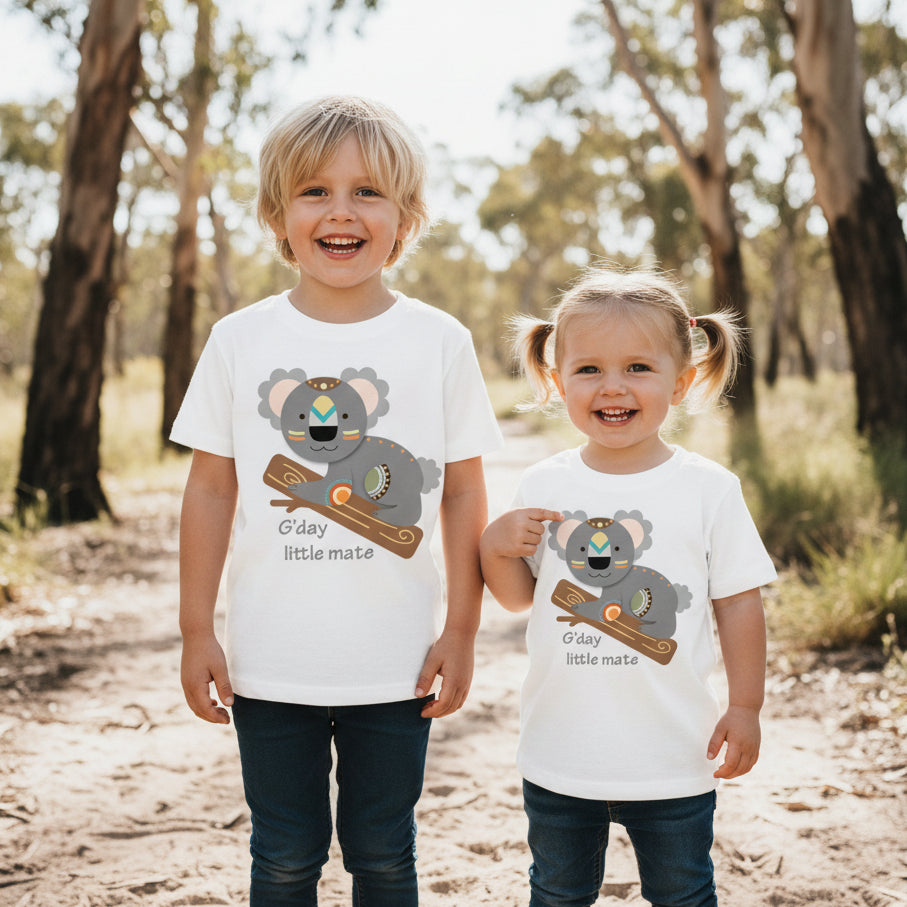 White kids t-shirt with a folk-art koala on a gum branch and G'day little mate slogan.