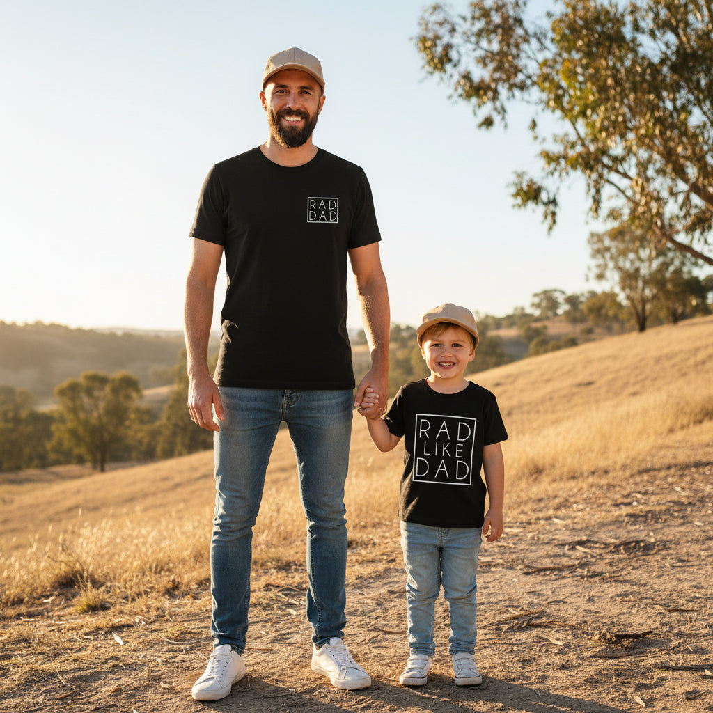Dad and son in matching black tees with boxed prints reading Rad Dad and Rad Like Dad.