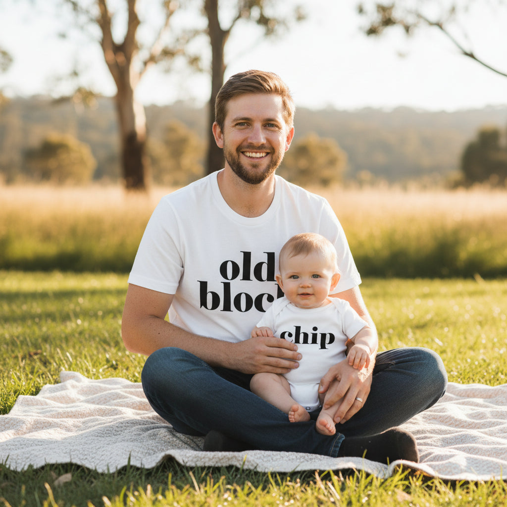 White t-shirt reading Old Block beside a white baby bodysuit reading Chip.