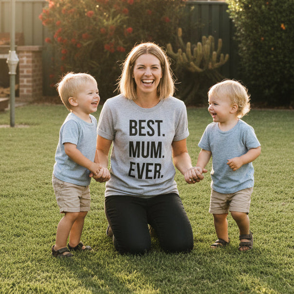 best mum ever shirt lifestyle mum with kids backyard australia mothers day gift
mum wearing best mum ever t shirt with children outdoor family moment australia
best mum ever graphic tee lifestyle image mum and toddlers casual outfit
mothers day shirt best mum ever design t shirt hoodie jumper australia