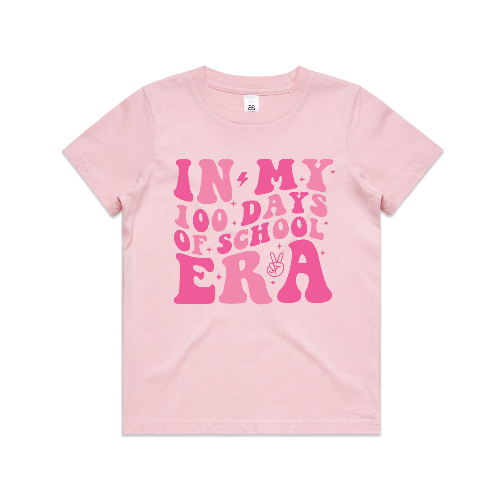 A light pink short-sleeve t-shirt with a vibrant pink retro-style graphic on the front that reads 'IN MY 100 DAYS OF SCHOOL ERA' with small decorative details like stars, lightning bolts, and a peace sign, shown on a plain white background.