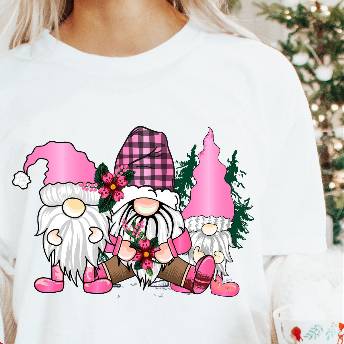 White sweater with Christmas-themed gnomes design worn by a person, with a red circle indicating sizes for baby, kids, and adults.