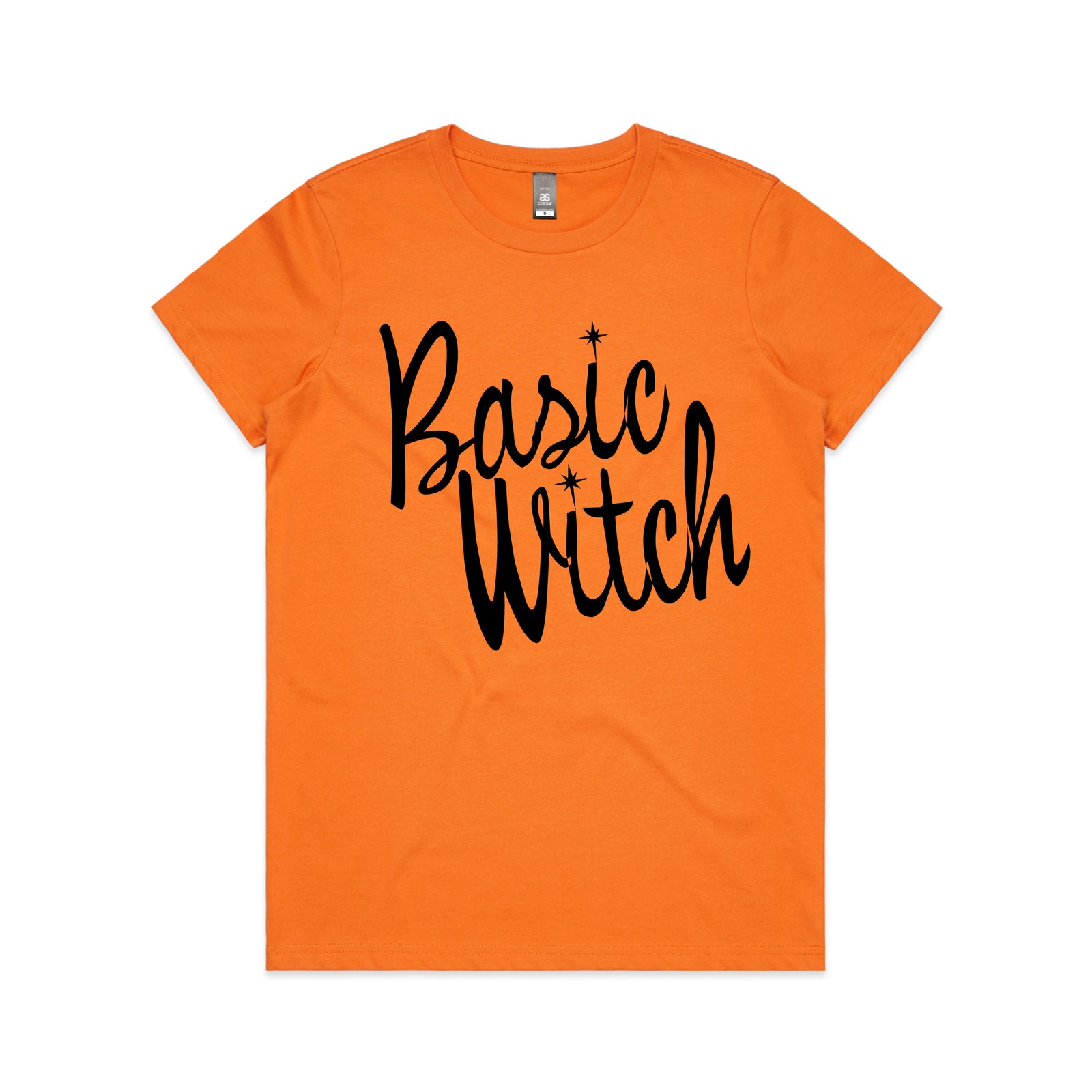 An orange short-sleeve crewneck t-shirt featuring the words 'Basic Witch' printed in a black cursive font with small star accents, displayed flat against a white background.