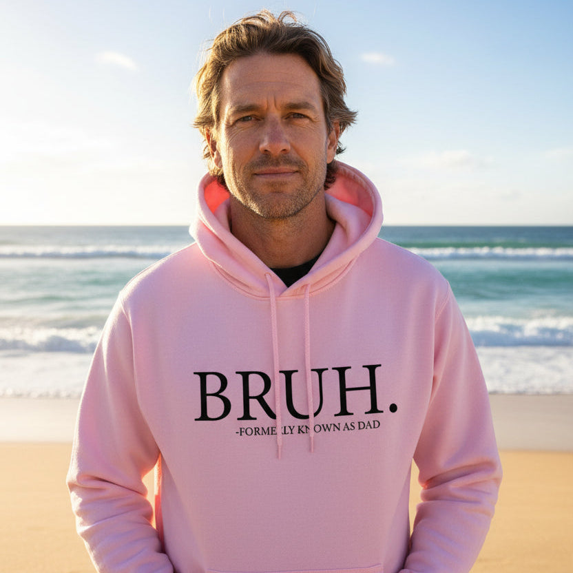Man wearing a pink hoodie that reads Bruh, formerly known as Dad.