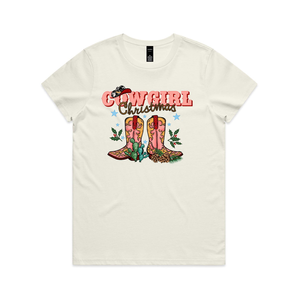 T-shirt with a Cowgirl Christmas design featuring pink western boots, a cow print hat, cactus and holly.