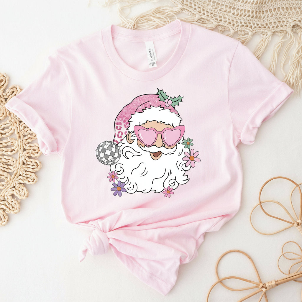 Pink t-shirt with a cartoon Santa Claus design on a white background