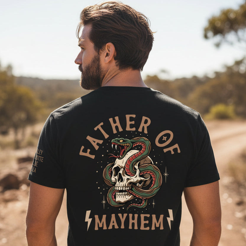 Man wearing a black t-shirt with a tattoo style skull and snake back print reading Father Of Mayhem and personalised names on the sleeve.