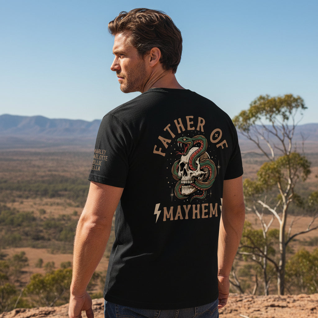 Man wearing a black t-shirt with a tattoo style skull and snake back print reading Father Of Mayhem and personalised names on the sleeve.