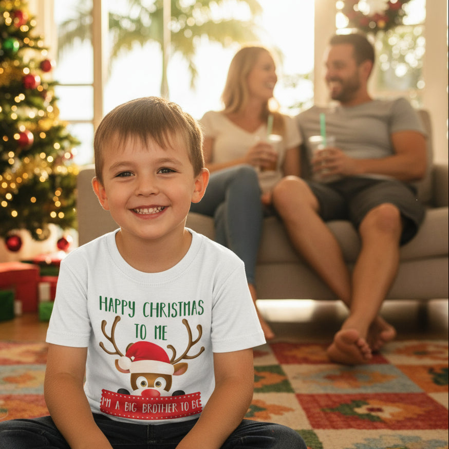 Child wearing a Christmas-themed t-shirt with parents in the background