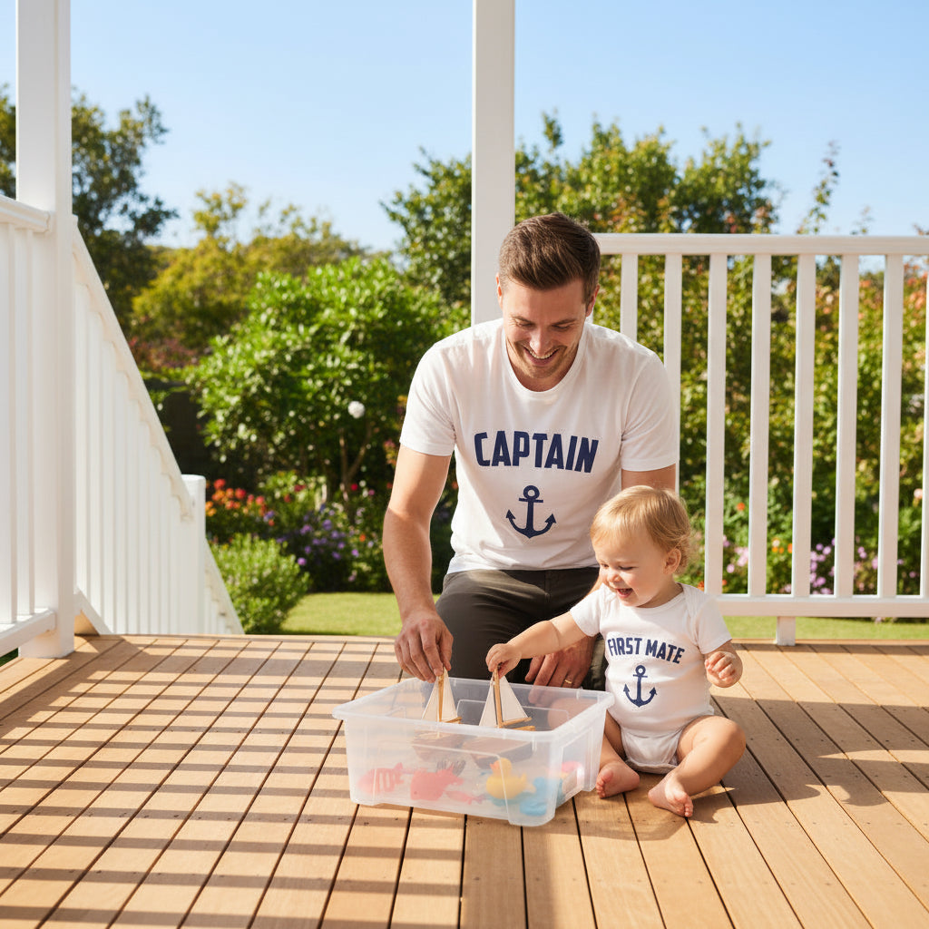White t-shirt reading Captain and white baby bodysuit reading First Mate, both with a navy anchor.