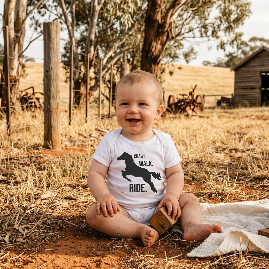 Baby bodysuit with a galloping horse silhouette and the words Crawl Walk Ride.