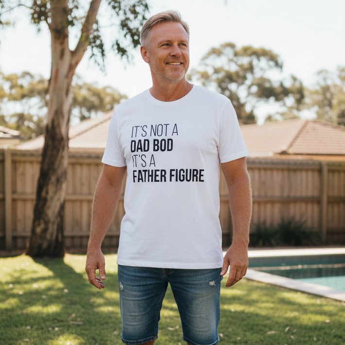 White t-shirt with bold white text reading It's Not A Dad Bod It's A Father Figure.