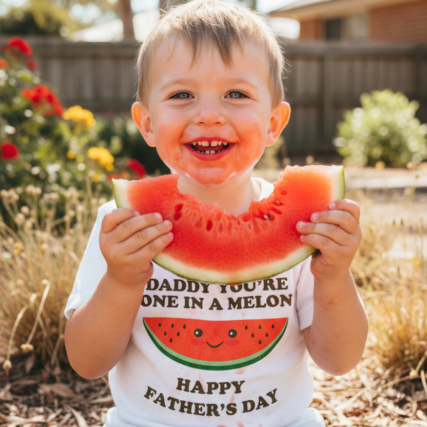 White kids long-sleeve t-shirt with a smiley watermelon and text reading Daddy You're One In A Melon, Happy Father's Day.