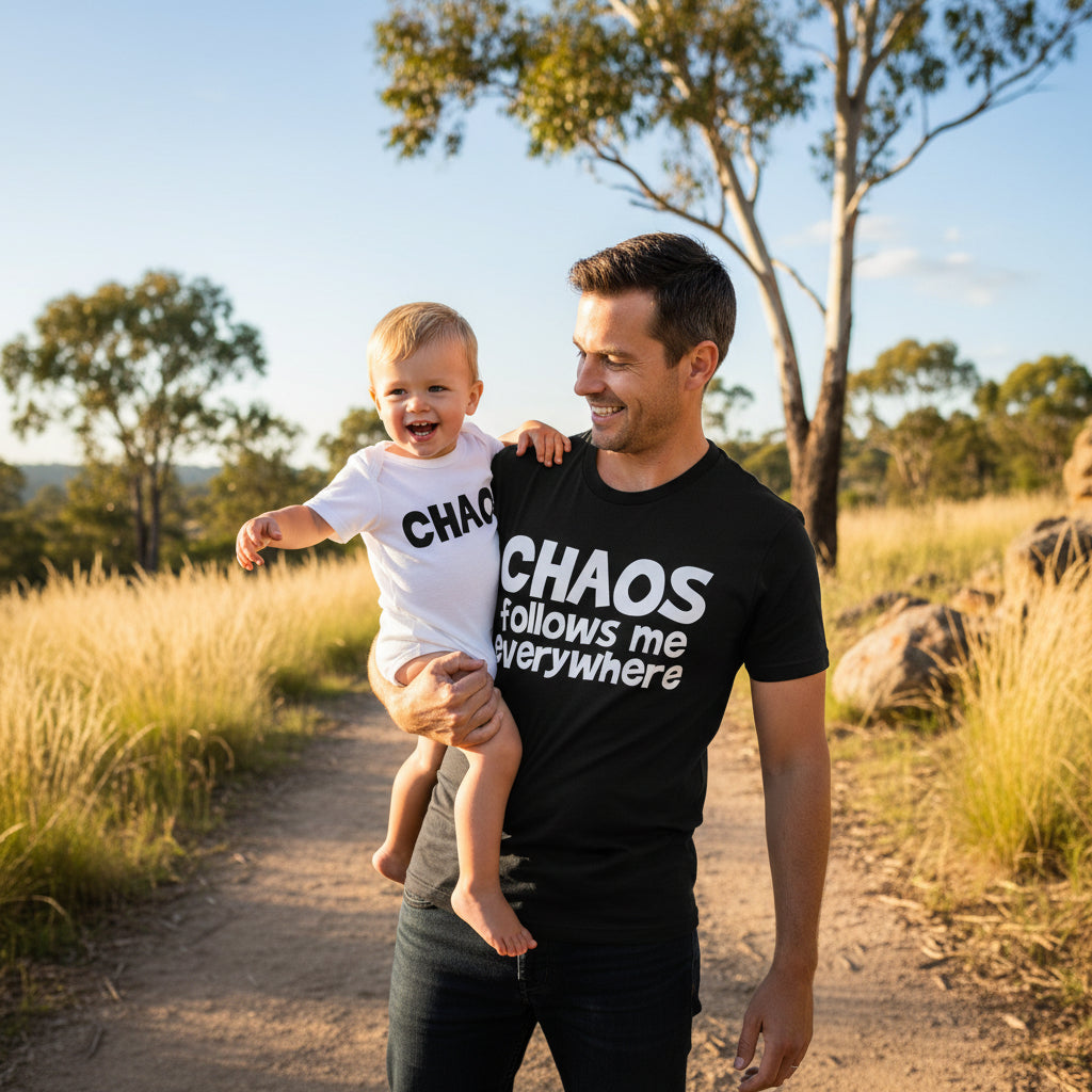 Black t-shirt reading Chaos Follows Me Everywhere beside a white baby bodysuit reading Chaos.