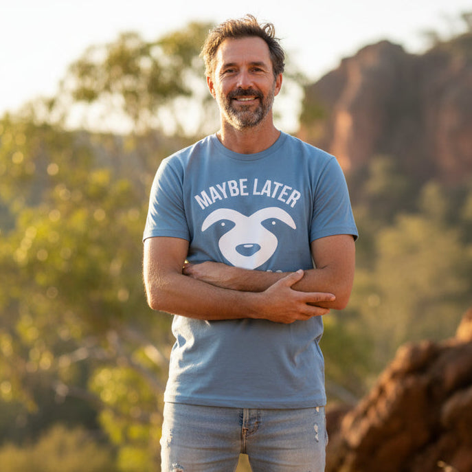 Blue t-shirt with a sloth face and claws design reading Maybe Later.
