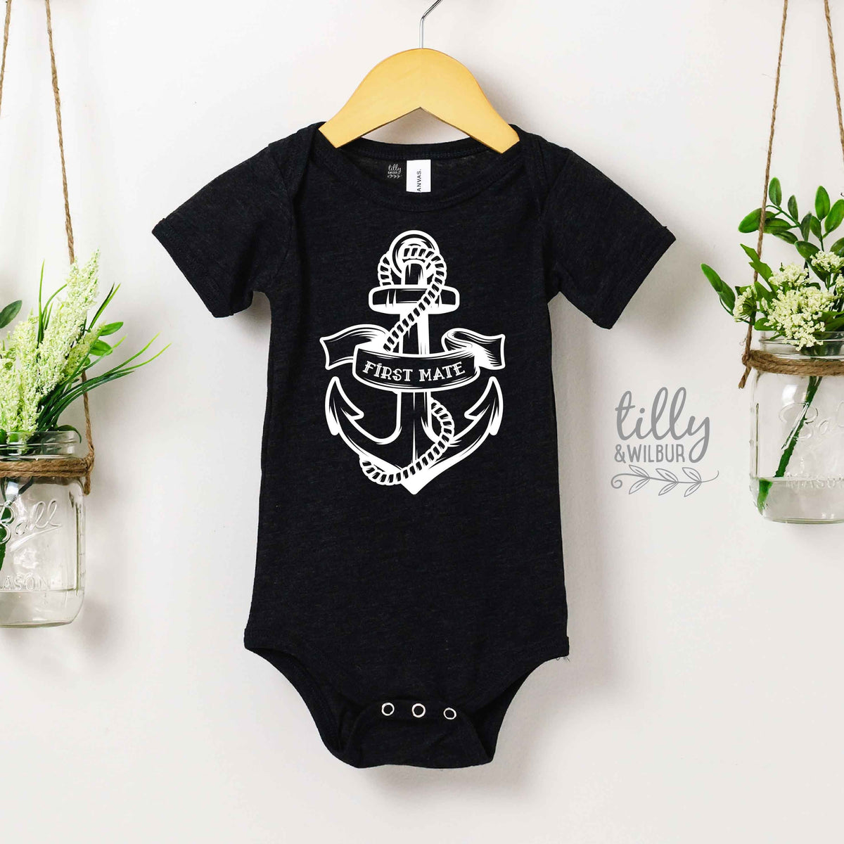 Black bodysuit with a white nautical anchor and rope design and the words FIRST MATE on a banner.