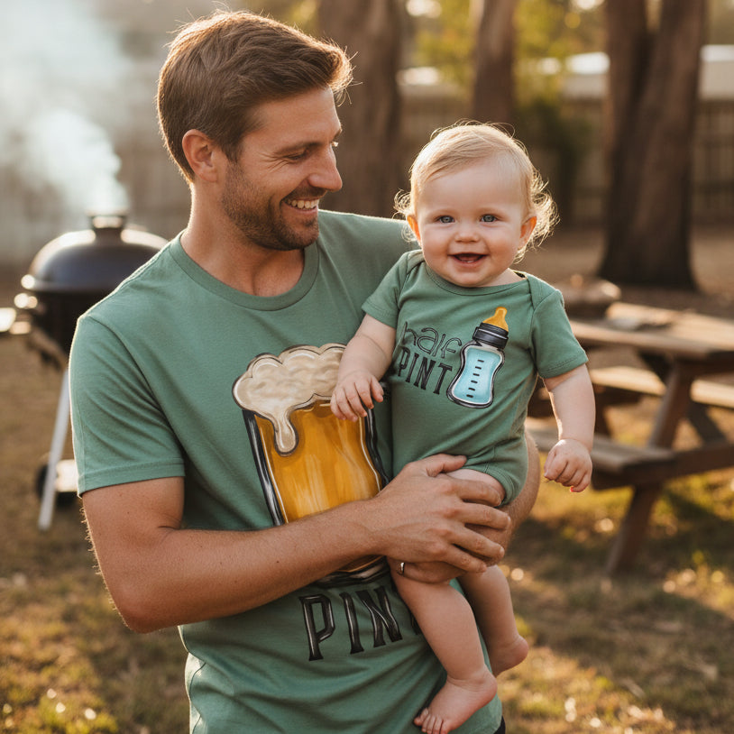 Green t-shirt with 'Pint' design and matching green baby onesie with 'Hale Pint' design on a white background.