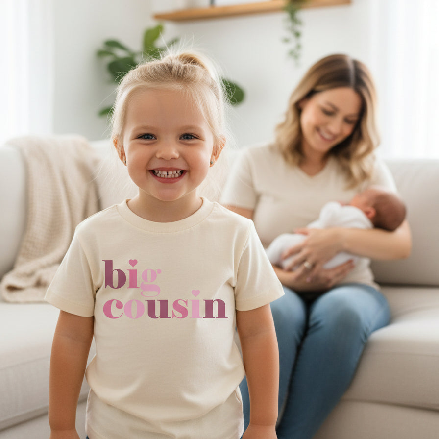 Natural kids t-shirt with pink lettering and hearts reading big cousin.
