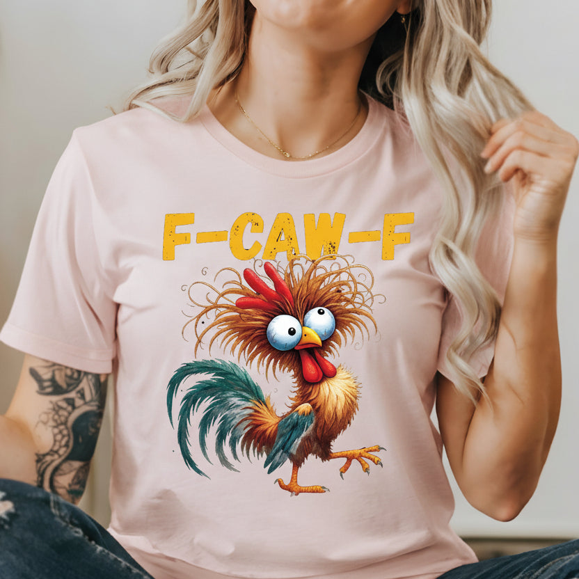 Person wearing a white t-shirt with a cartoon rooster and 'F-CAW-F' text.