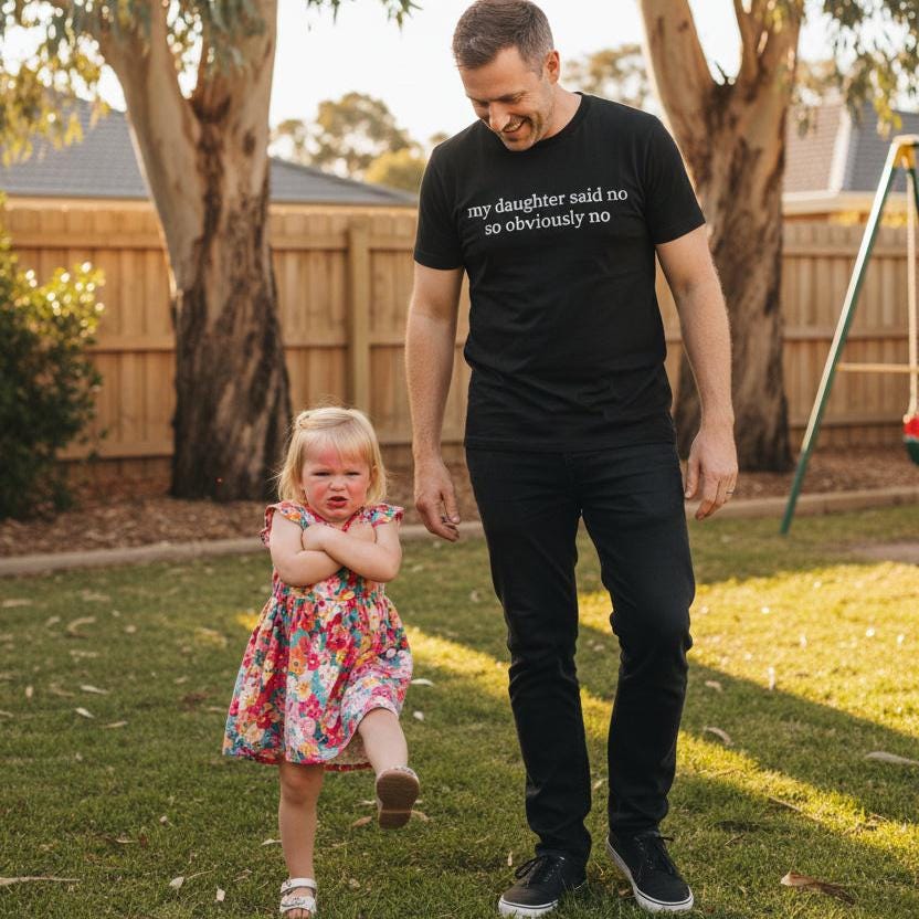 Black t-shirt with white serif text reading my daughter said no so obviously no, displayed flat against a white background.