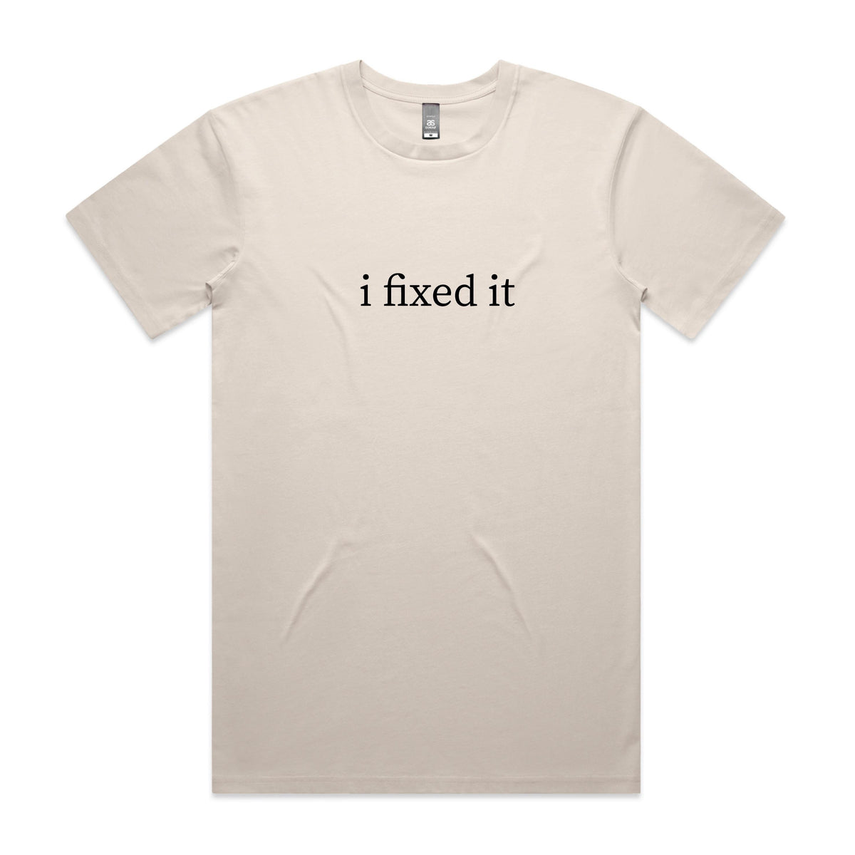 Natural cream t-shirt with black lowercase serif text reading i fixed it, displayed flat against a white background.