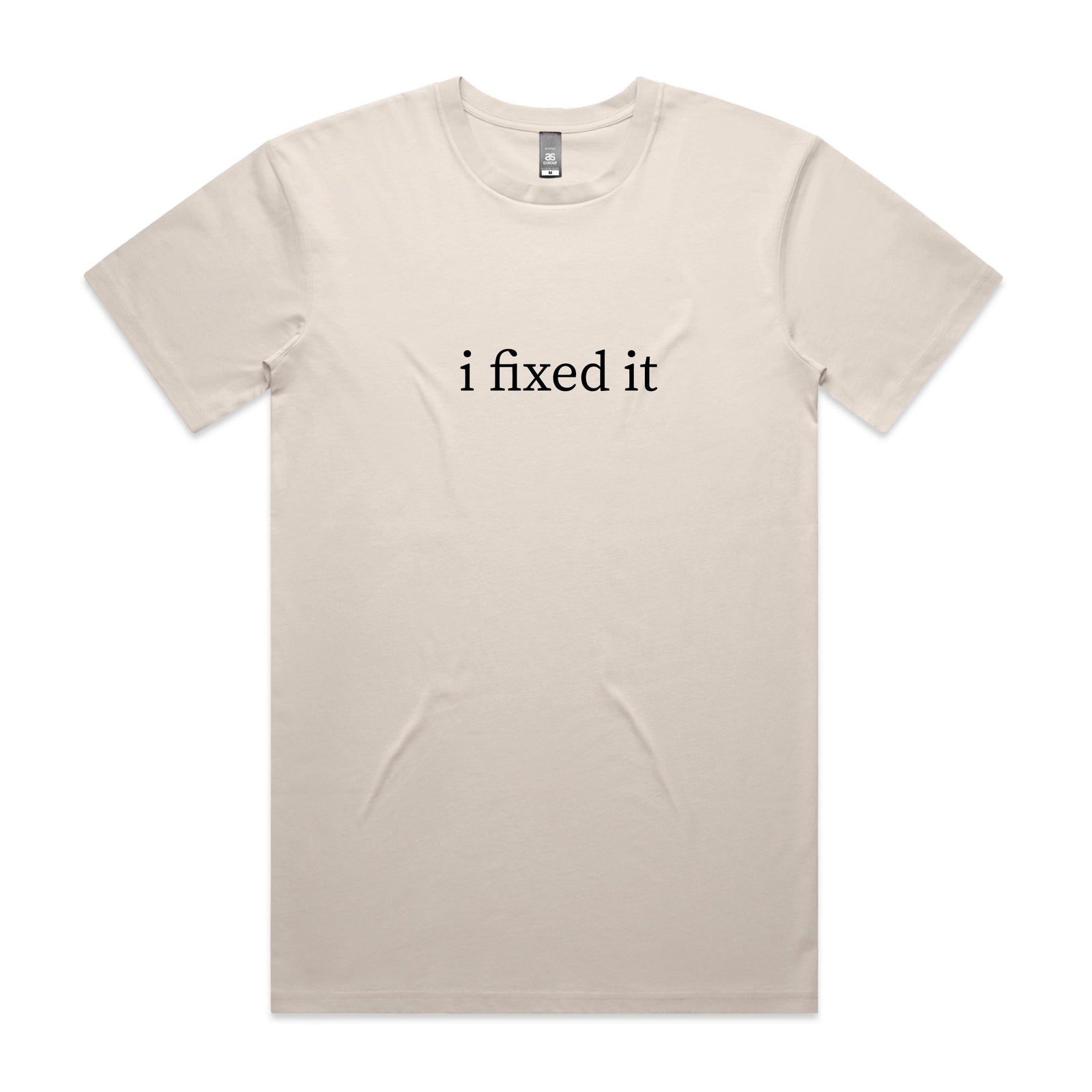 Natural cream t-shirt with black lowercase serif text reading i fixed it, displayed flat against a white background.