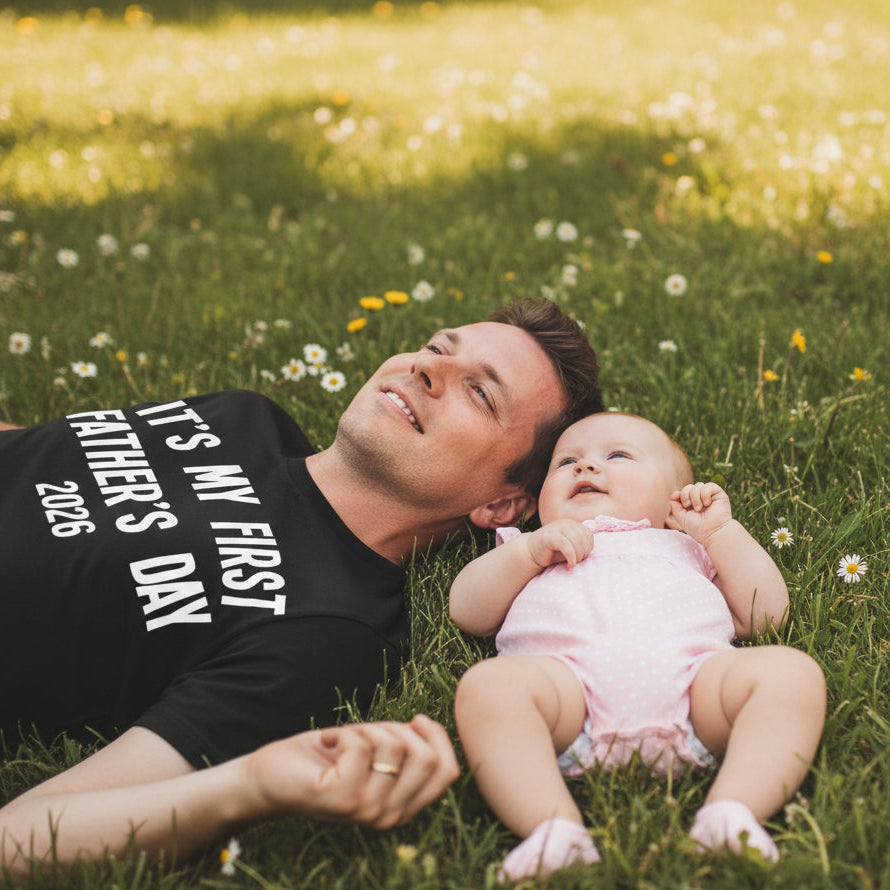 Black men's tee that reads It's My First Father's Day with the year