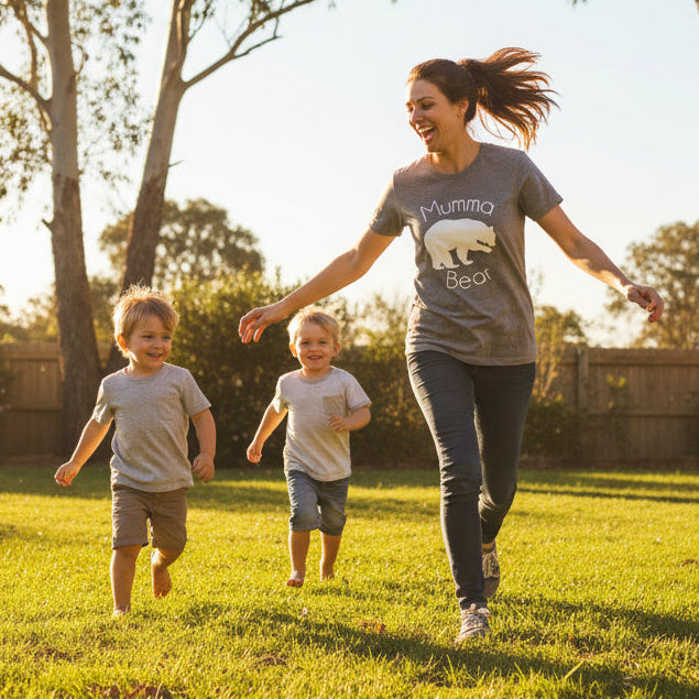 Woman wearing Mumma Bear shirt outdoors in a sunny setting, Mother’s Day gift idea