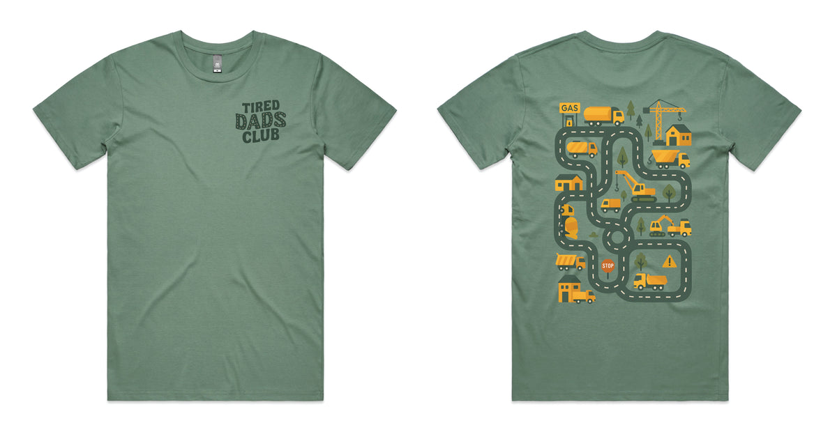 A sage green short-sleeve t-shirt shown from both the front and back. The front features the text 'TIRED DADS CLUB' printed in dark green on the left chest.