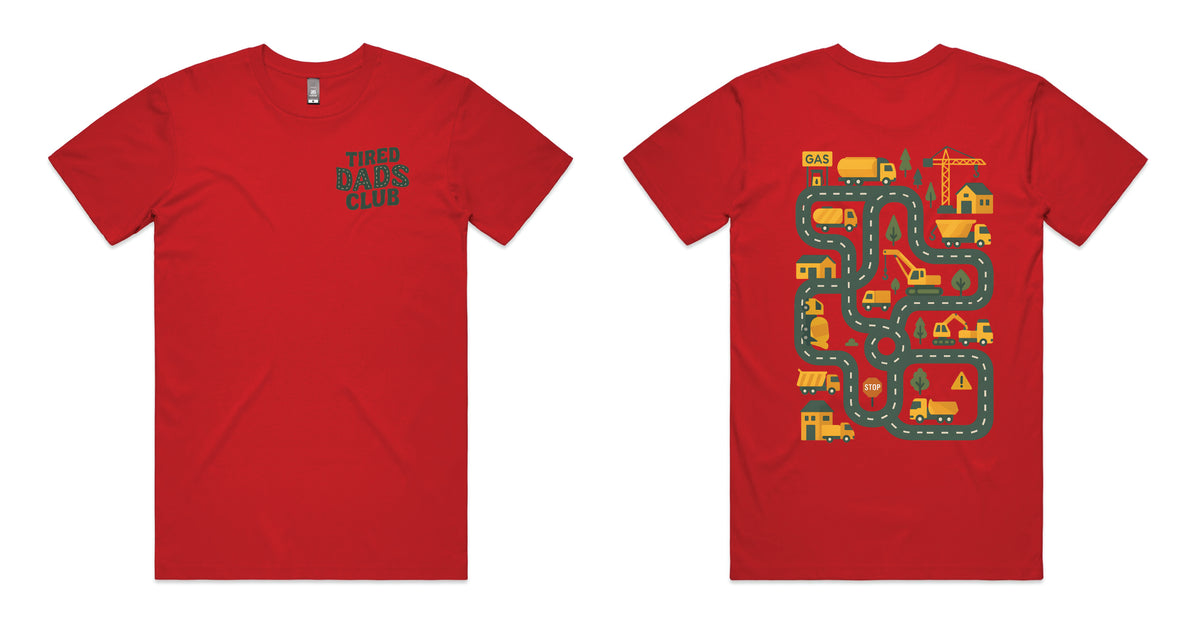 Red coloured t-shirt with Tired Dads Club on the front and a construction road play map with trucks and cranes on the back.