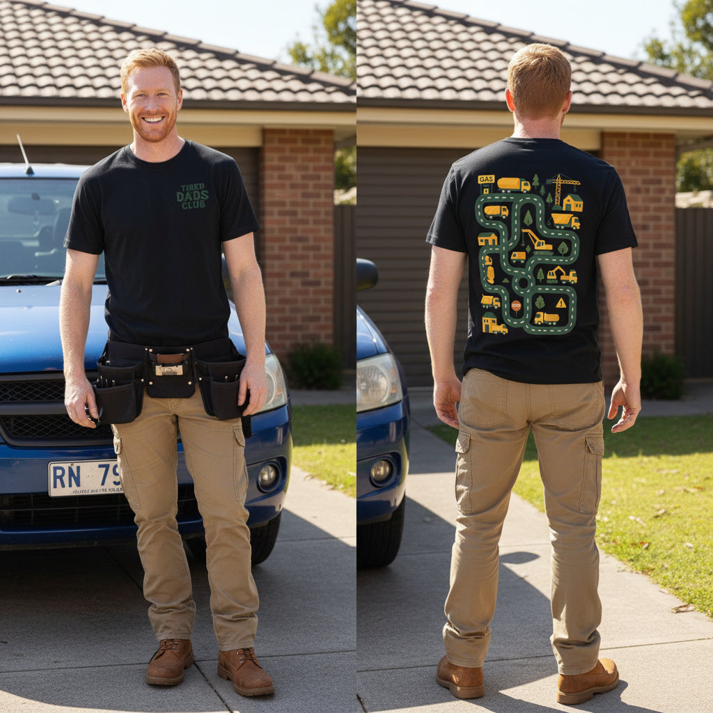 Two black short-sleeve t-shirts shown side by side on a white background. The left shirt has green text reading 'TIRED DADS CLUB' on the left chest.