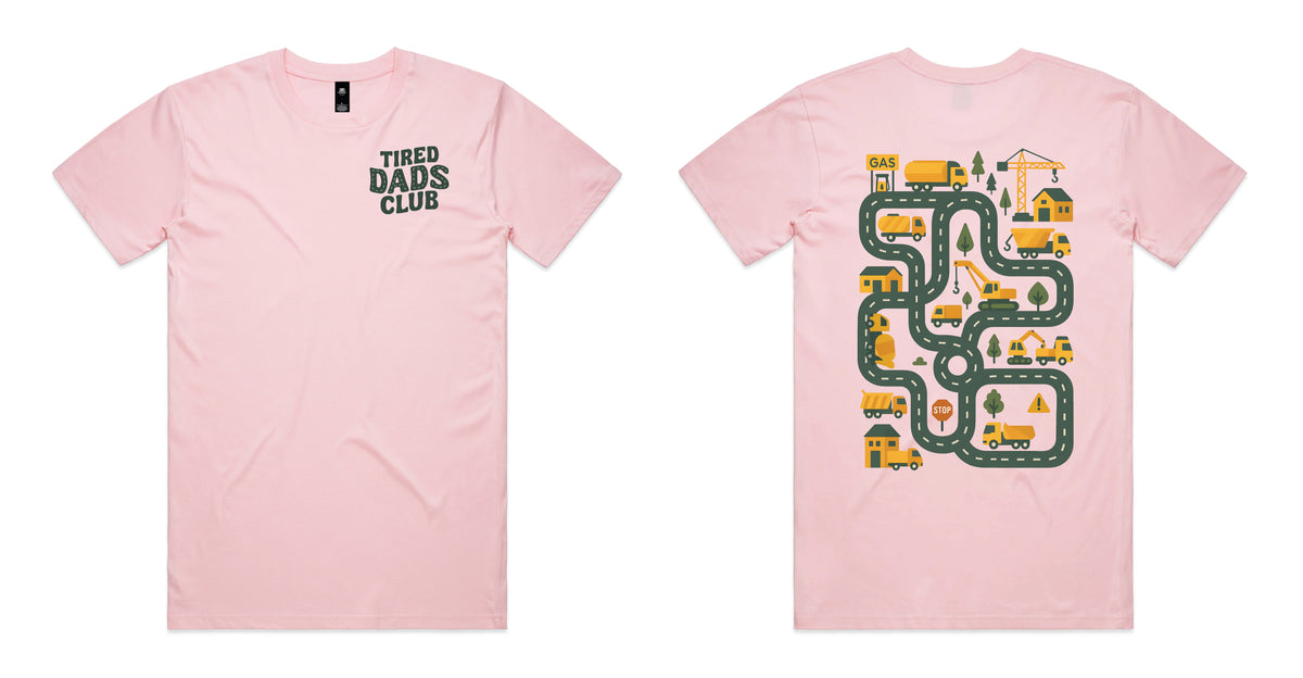 A light pink short-sleeve t-shirt shown from both the front and back. The front features the text 'TIRED DADS CLUB' in dark green on the left chest.