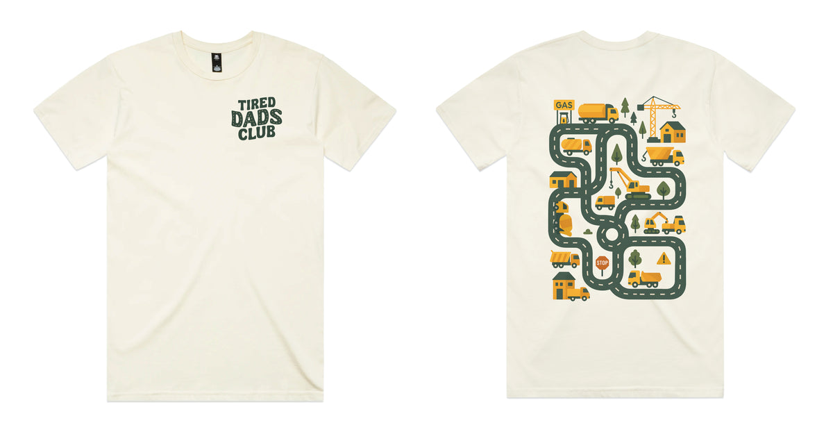 Natural coloured t-shirt with Tired Dads Club on the front and a construction road play map with trucks and cranes on the back.