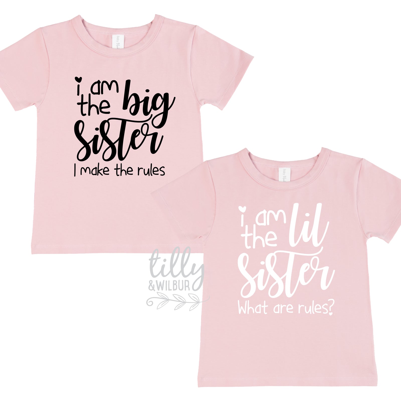Two pink t-shirts reading I am the Big Sister I make the rules and I am the Lil Sister what are rules.