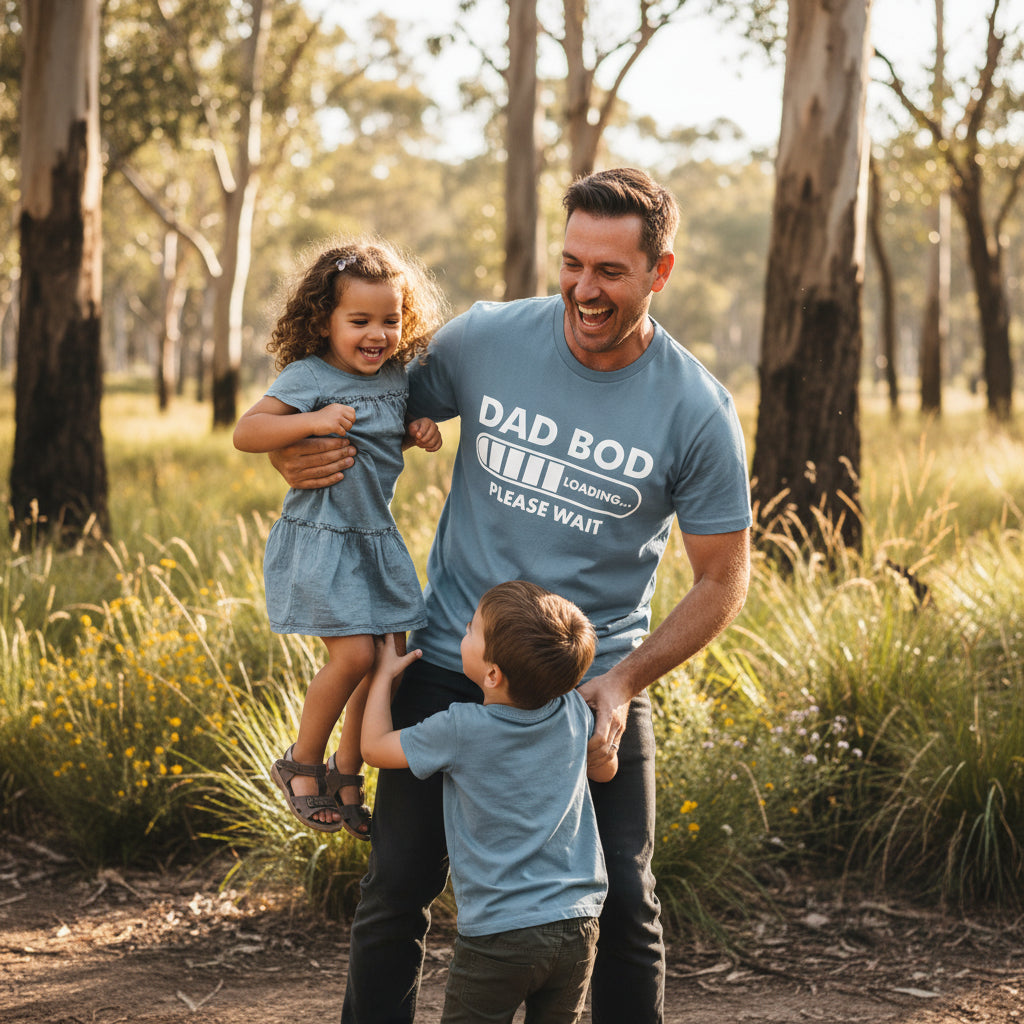 Blue t-shirt reading Dad Bod Loading Please Wait with a white progress bar graphic.