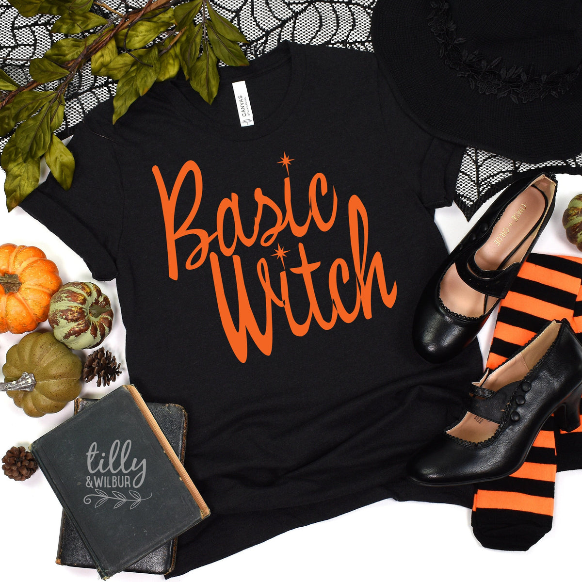 Black t-shirt reading Basic Witch in orange script