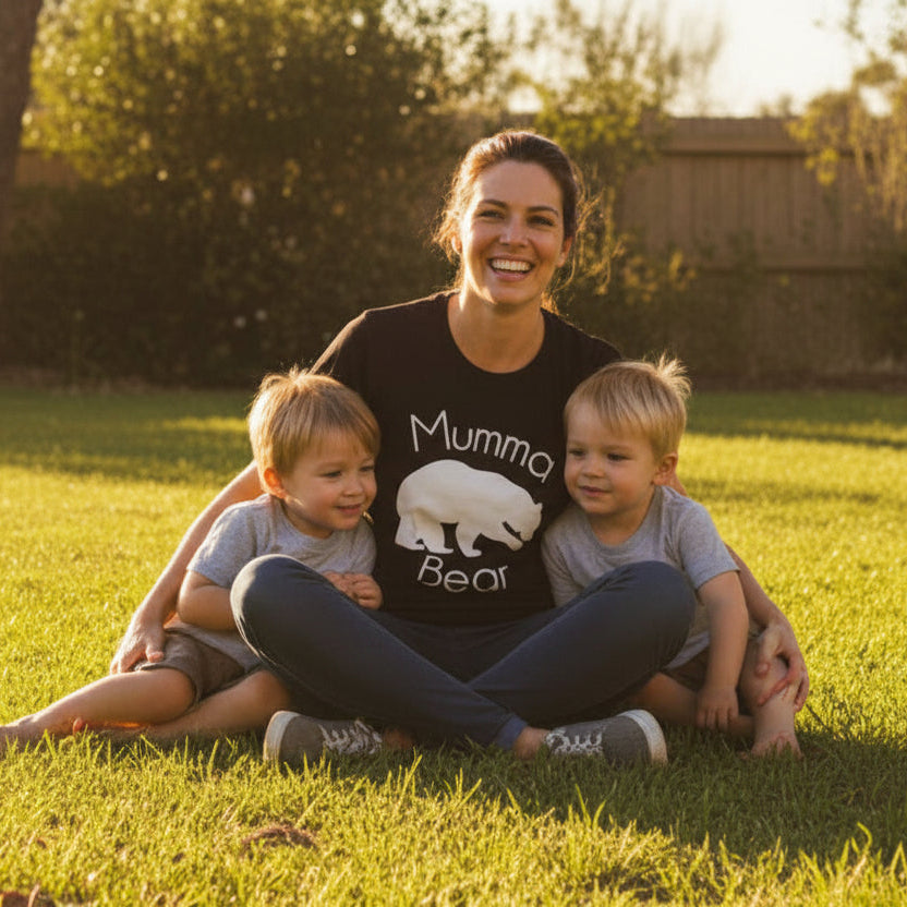 Woman wearing Mumma Bear shirt outdoors in a sunny setting, Mother’s Day gift idea